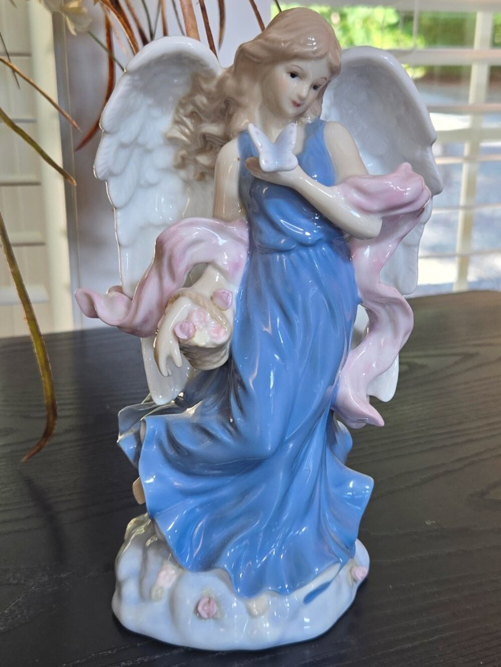 Vintage Ganz 9 inch angel porcelain statue with flowers and butterfly.